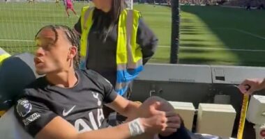 Xavi Simons was seen firing back at a Wolves fan as the injured Tottenham star was wheeled away
