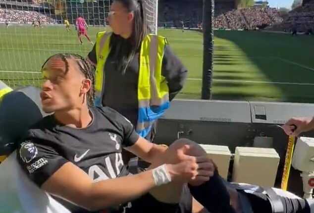 Xavi Simons was seen firing back at a Wolves fan as the injured Tottenham star was wheeled away