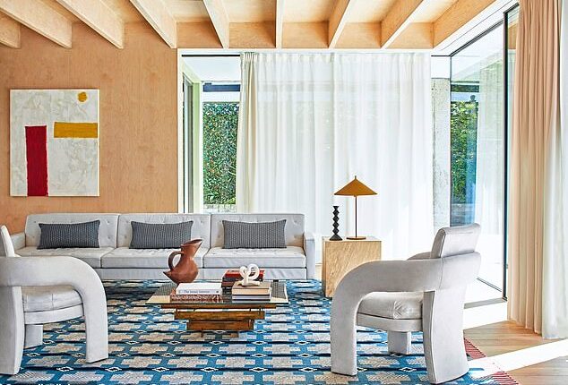 Flatweave rug by arumfellow.com. For a similar sofa and chairs, try castlery.com. Mah-gallery.com sells and hires out a range of abstract artwork