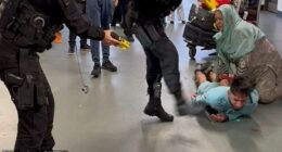 Firearms officer PC Zachary Marsden kicks Mohammed Fahir Amaaz, now 21, in the face during the fracas at Manchester Airport in July 2024