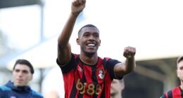 Matchwinner Rayan celebrates with the Bournemouth fans at the end of the 1-0 win at Fulham