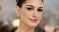 Anne Hathaway has finally addressed speculation that she's had a facelift after baffling fans with her new look (pictured at the Met Gala)