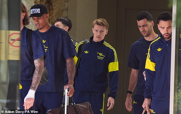 Gabriel (left) looked at the ground as he left the team hotel after the Champions League defeat