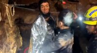 After the men were finally free from their predicament and above surface, they were greeted by rescuers who wrapped them foil blankets