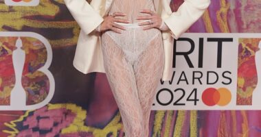 Olivia Attwood, 32, went braless in a sexy long-sleeved white lace catsuit at the Brit Awards in London on Saturday
