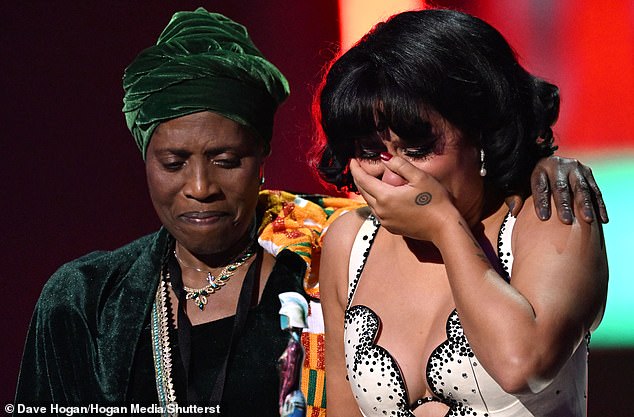 Raye, 26, called her grandmother Agatha Dawson to the stage with her as she collected Album Of The Year at the Brits on Saturday - and fans can't get enough