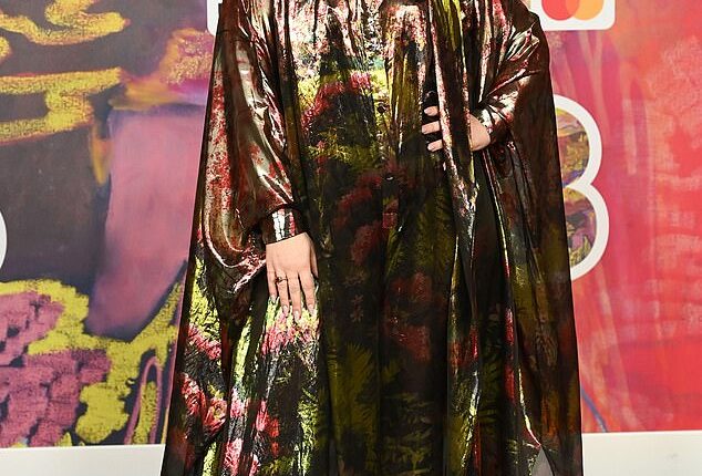 Jessie Ware showcased her unique sense of style as she stepped out to the 2024 BRIT Awards on Saturday wearing a shiny floral bat-wing cape