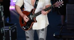 Brian May looked the picture of health of Friday as he took to the stage at the Coachella festival, in Indio, California in the wake of his stroke
