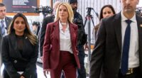 Former Attorney General Pam Bondi, center, arrives for her closed-door interview on Capitol Hill Friday morning