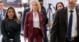 Former Attorney General Pam Bondi, center, arrives for her closed-door interview on Capitol Hill Friday morning