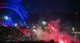 Flares and fireworks were seen close to the Eiffel Tower, which was illuminated in the colours of Paris Saint-Germain following their win over Arsenal