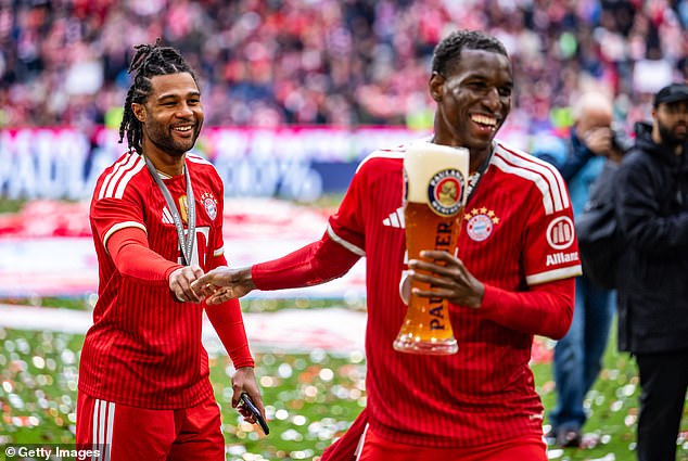 Nicolas Jackson celebrates with Serge Gnabry after Bayern won the Bundesliga