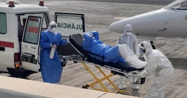 Health workers are seen evacuating a patient from luxury cruise liner MV Hondius, which is experiencing a hantavirus outbreak