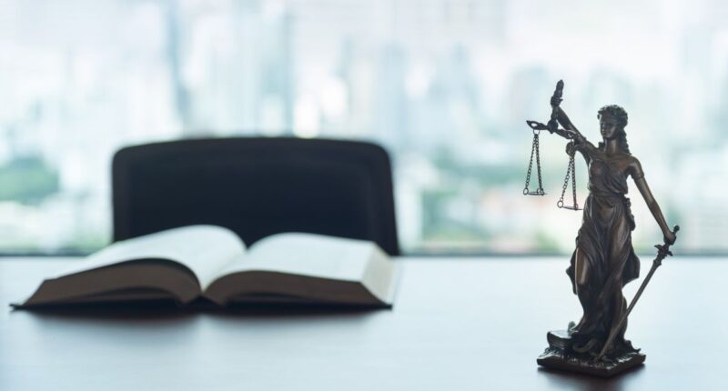 scales of justice and book
