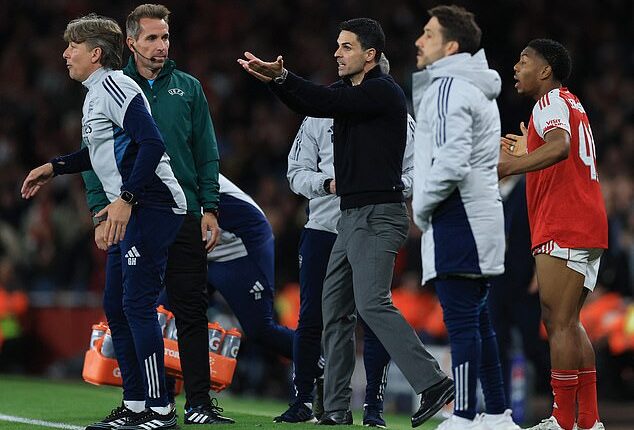 An ESPN host has apologised to Mikel Arteta (centre) after suggesting he deserved to be 'punched in the face'