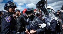 Police officers restrain anti-ICE protesters outside Delaney Hall, which is being used as an ICE detention center, in Newark, New Jersey, on Saturday