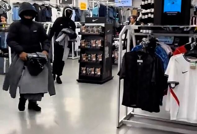 Hordes of hooded youths with balaclavas on Saturday raided a JD Sports store on the Ilford High Road of hangers of merchandise