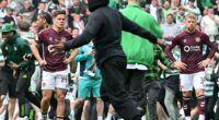 Hundreds of Celtic supporters stormed the pitch on Saturday after clinching the title