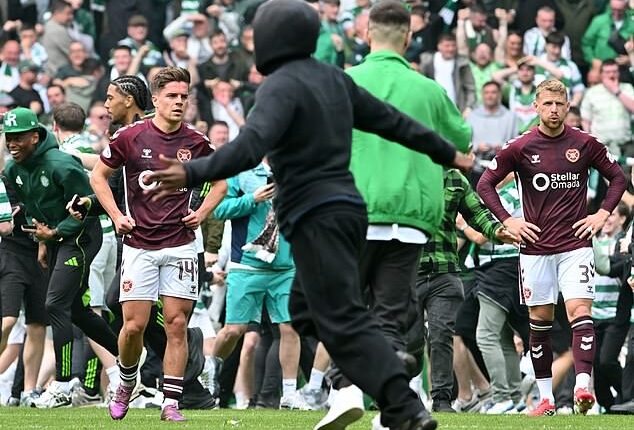 Hundreds of Celtic supporters stormed the pitch on Saturday after clinching the title