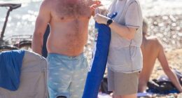 On Monday afternoon Angela Rayner, 46, caused fellow revelers to do a double take when she was spotted soaking up the sunshine on packed Brighton beach with her boyfriend