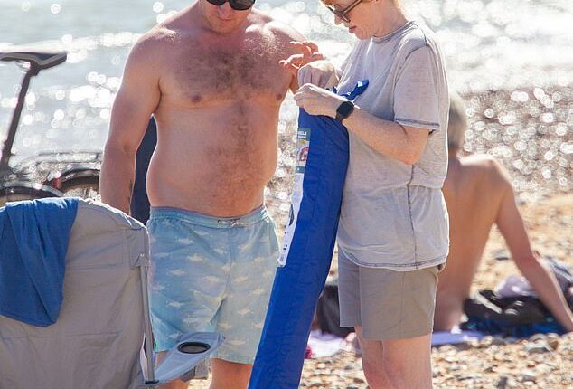 On Monday afternoon Angela Rayner, 46, caused fellow revelers to do a double take when she was spotted soaking up the sunshine on packed Brighton beach with her boyfriend