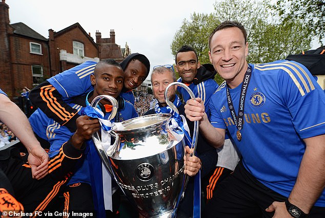 John Obi Mikel (second left) has claimed Chelsea are deliberately ignoring staff who were involved under former owner Roman Abramovich (centre)