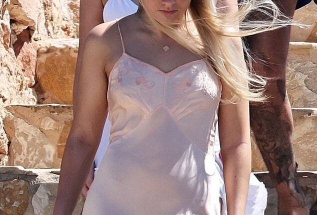 Harper Beckham seemed to have raided her mum Victoria's wardrobe once again as she headed out for a swanky lunch with her family during their holiday in Formentera