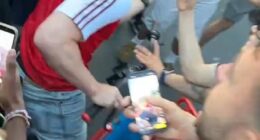 An Arsenal fan was mobbed and roughed up by PSG supporters in Paris in harrowing scenes