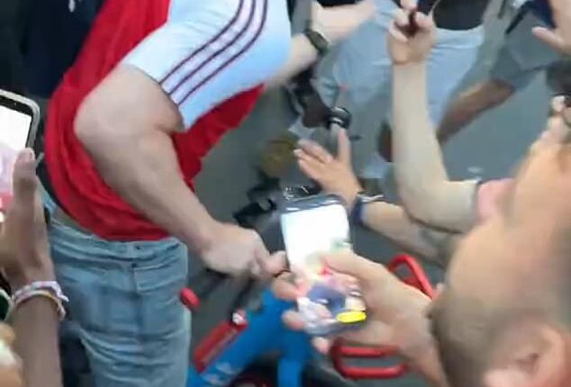 An Arsenal fan was mobbed and roughed up by PSG supporters in Paris in harrowing scenes