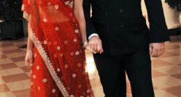 Michaele and Tareq Salahi walk through the Bookseller's area of the White House on November 24, 2009, where Barack Obama was hosting India's Prime Minister Manmohan Singh for the then president's first state dinner of his administration