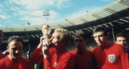 George Cohen, Bobby Moore (with trophy), Geoff Hurst and Martin Peters celebrate England's World Cup triumph at Wembley in 1966