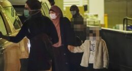 A woman, formerly linked to the terror group Islamic State, has been charged by police after returning to Australia (Pictured, a cohort arriving in Sydney on Tuesday)