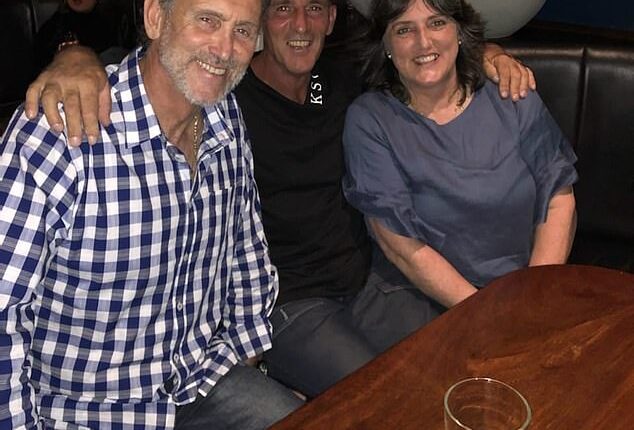 Collingwood legend Peter Daicos and his brother Victor (centre) are pictured in happier times