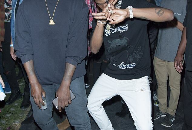 Italy has banned Kanye West (left) and Travis Scott from performing in July after 'concerns' from the Jewish community (pictured together in 2016)