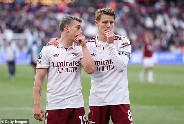 Jamie Carragher has suggested Martin Odegaard's (right) assist for Leandro Trossard (left) will 'win Arsenal the title'