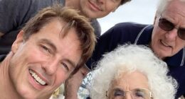 John Barrowman has revealed his mother Marion has died aged 91 as he shared a heartbreaking tribute on Instagram (pictured with his mother, father and husband Scott)