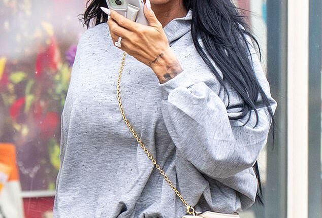 Katie Price was still wearing her wedding ring on Monday despite claims she fears she has been 'ghosted' by her husband Lee Andrews following his disappearance