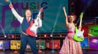 Mr Tumble with Samantha Dorrance performing on stage on the Time to Rock tour