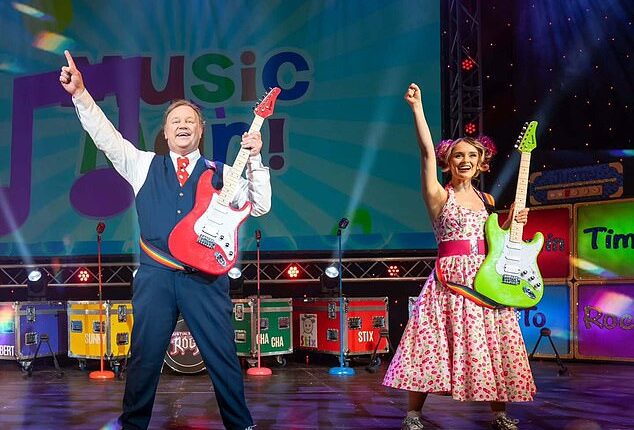 Mr Tumble with Samantha Dorrance performing on stage on the Time to Rock tour