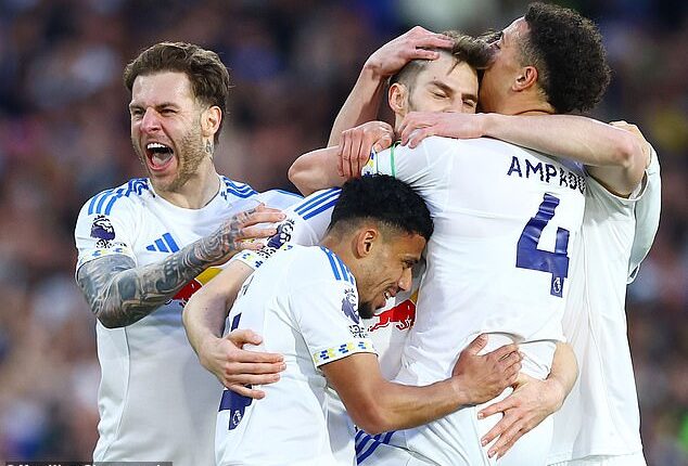Leeds players celebrate with the scorer of their first goal, Anton Stach, at Elland Road