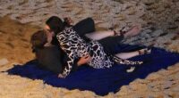 Lily Collins's fashionista alter-ego is seen sharing a steamy kiss on a beach with her on/off love interest Gabriel, played by Lucas Bravo, following a boozy party