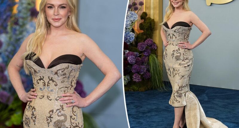 Lindsay Lohan hits Disney Upfronts 2026 red carpet in strapless lace-up couture