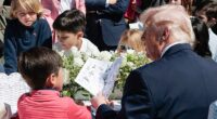 President Donald Trump is photographed as he tells a little boy at Monday's White House Easter Egg Roll how former President Joe Biden used an autopen to sign things