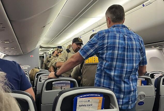 A United Airlines flight was forced to make an emergency landing after a passenger allegedly tried to storm the cockpit