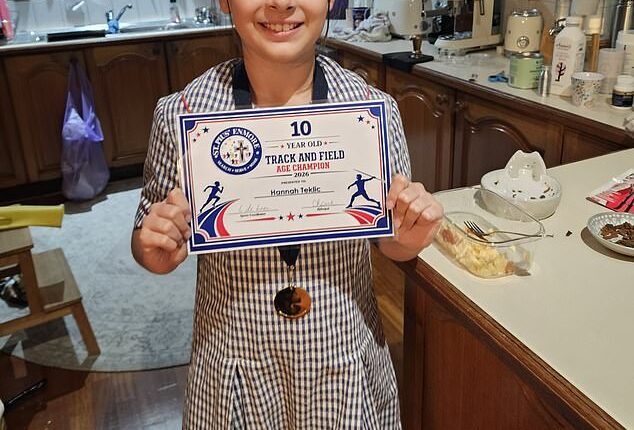 Hannah Teklic is seen proudly showing off her certificate for track and field champion on May 6, just hours before she suffered a rare brain bleed
