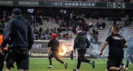 OGC Nice fans stormed the pitch after a goalless draw against Metz means the team faces a relegation play-off