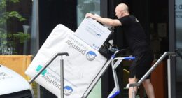 Removal men have begun taking Pep Guardiola's belongings out of his Manchester apartment