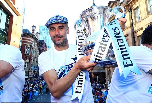 The Catalan has lifted 17 major trophies with the Etihad club - here he is pictured with the FA Cup trophy in 2019, his first of three