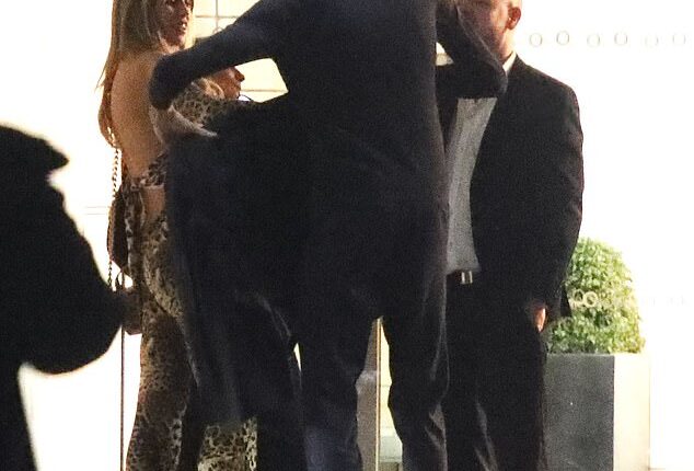 Peter Crouch looked out for glamorous wife Abbey Clancy as he gave her his jacket as they departed the BRITs after party on Saturday night