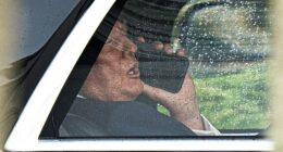 President Donald Trump speaks on the phone inside a vehicle as he returns to the White House in Washington, DC, USA, May 25